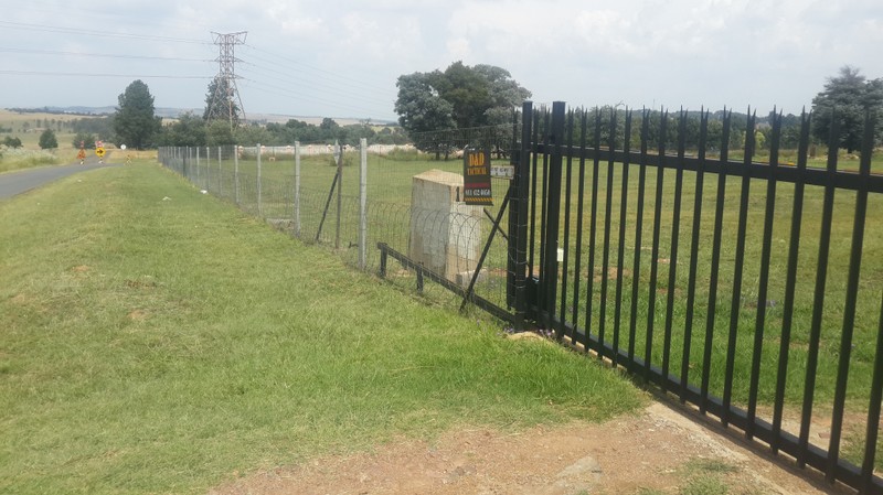Welded mesh fencing with concrete posts and flat wrap